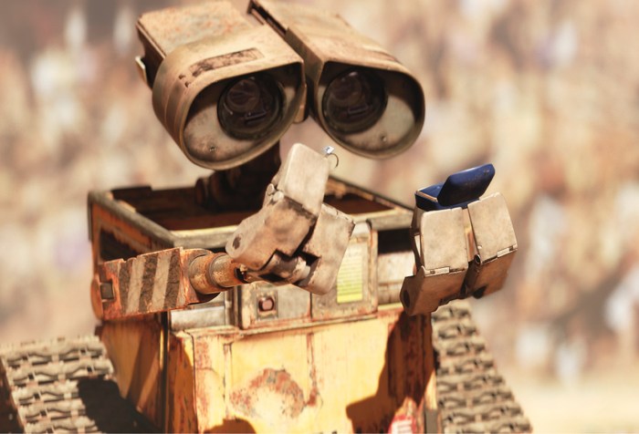 WALL-E inspects the valuable blue box